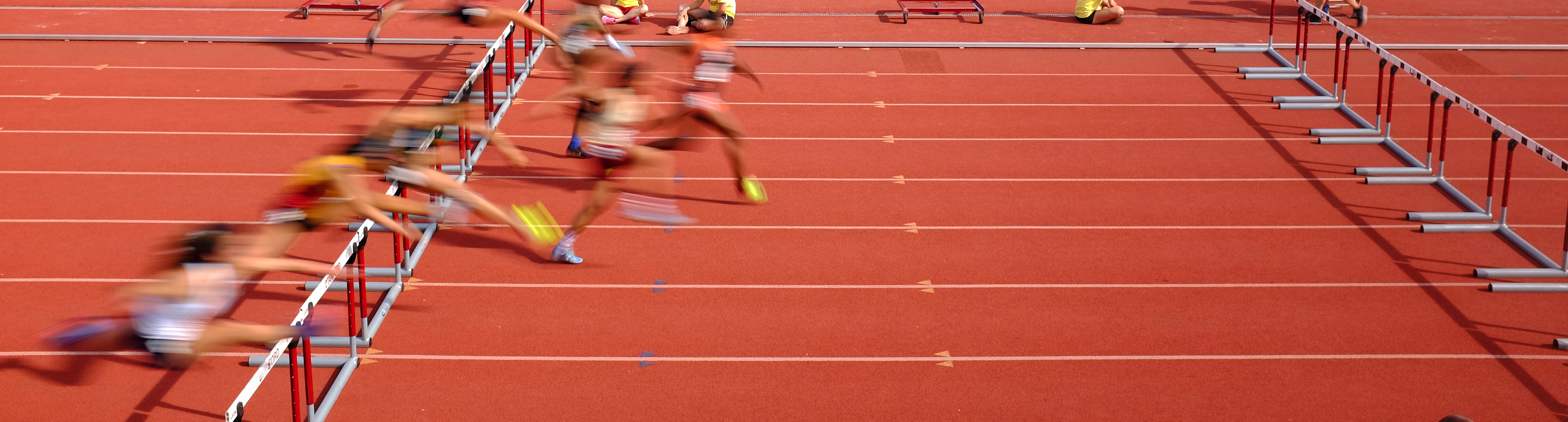 Track and field athletes running