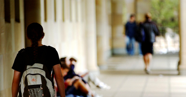 Students walking along a corridor