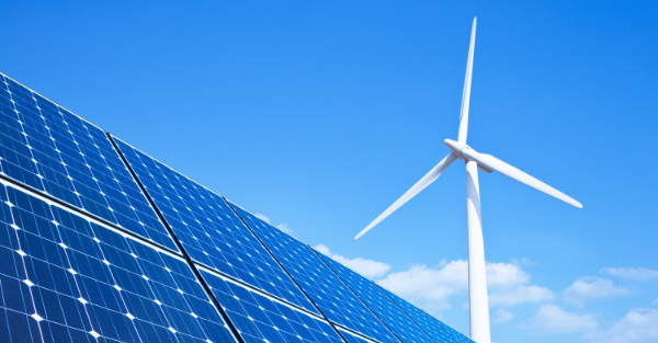 Image of solar panels and wind power station.