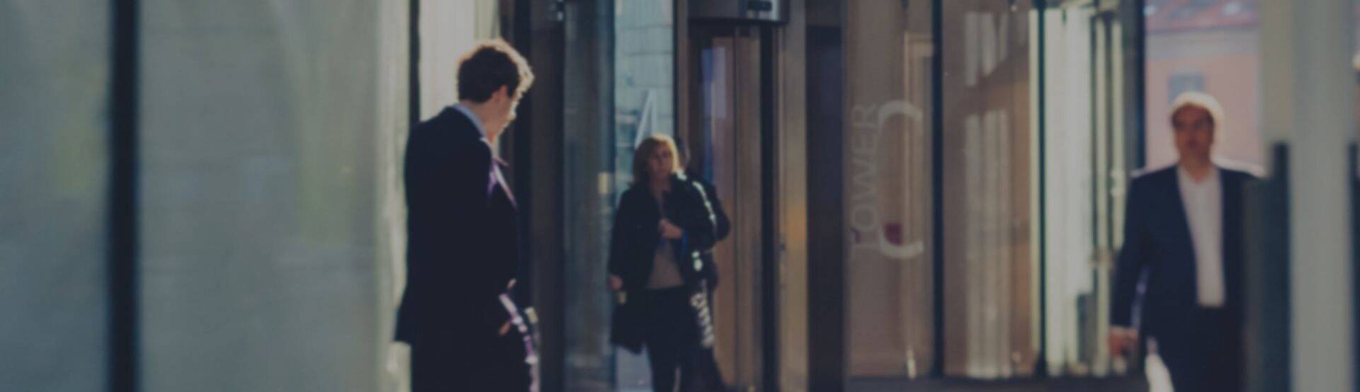 Three office workers discussing business