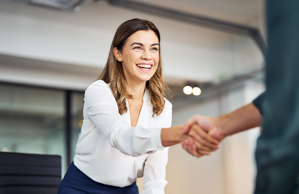 Women shaking hands in a business meeting