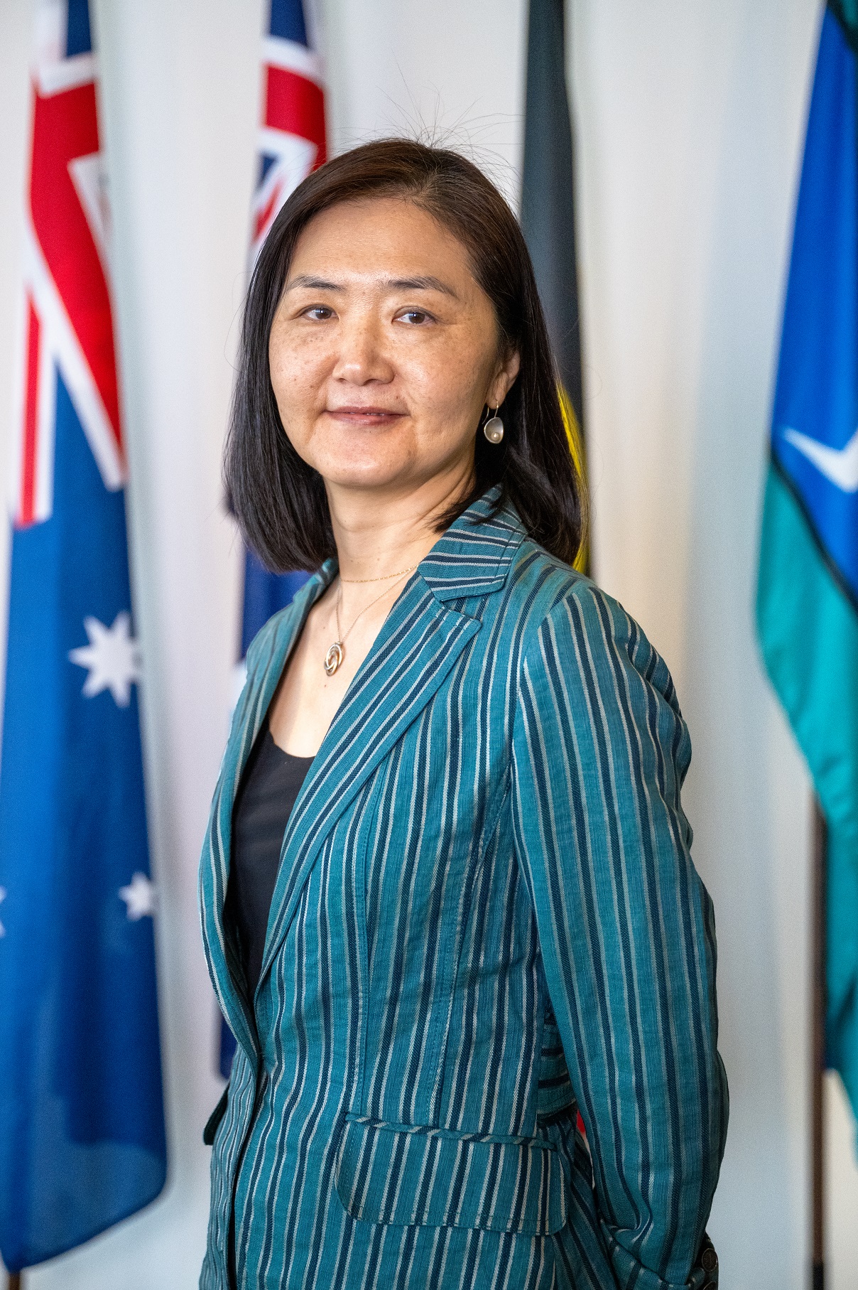 Headshot of Joy Tang, Principal Trade and Investment Officer.